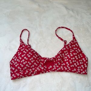 red bikini top with white and black flowers